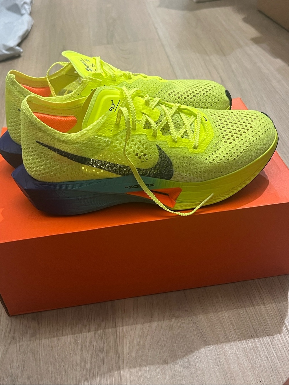 Nike Women's Flyknit Racing Shoes in Neon Yellow with Black Swoosh